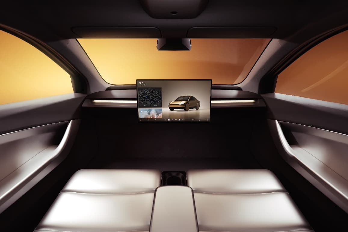 The back seat of a car with a monitor

Description automatically generated