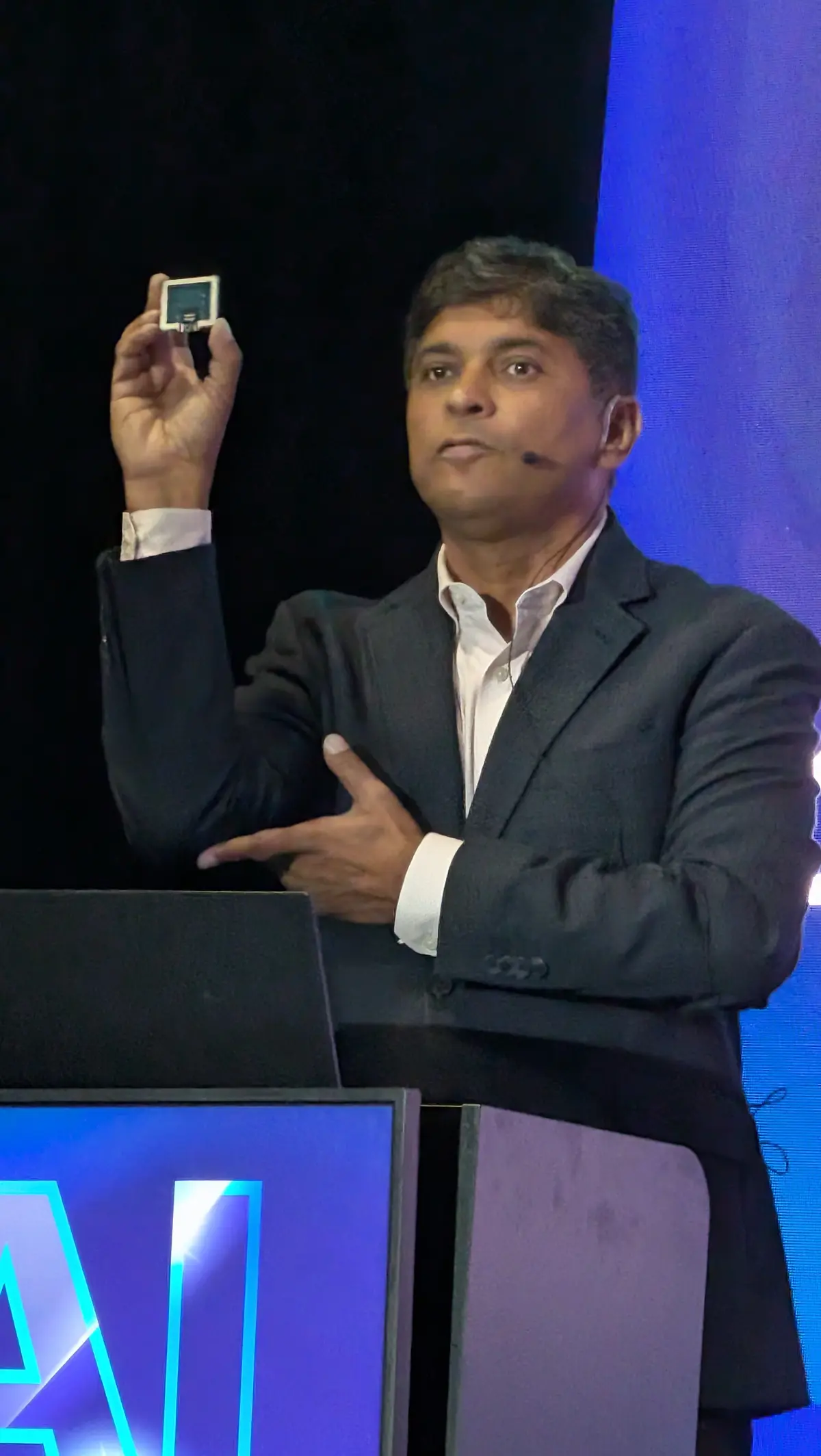Ayar Labs Chief Strategy Officer Vivek Gupta shows the company’s TeraPHY optical engine for scale-up. The target is volume shipments in 2028.
